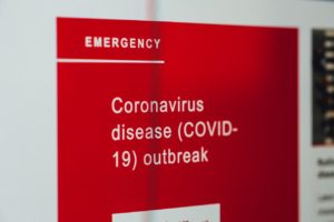 A sign noting the emergency related to COVID-19